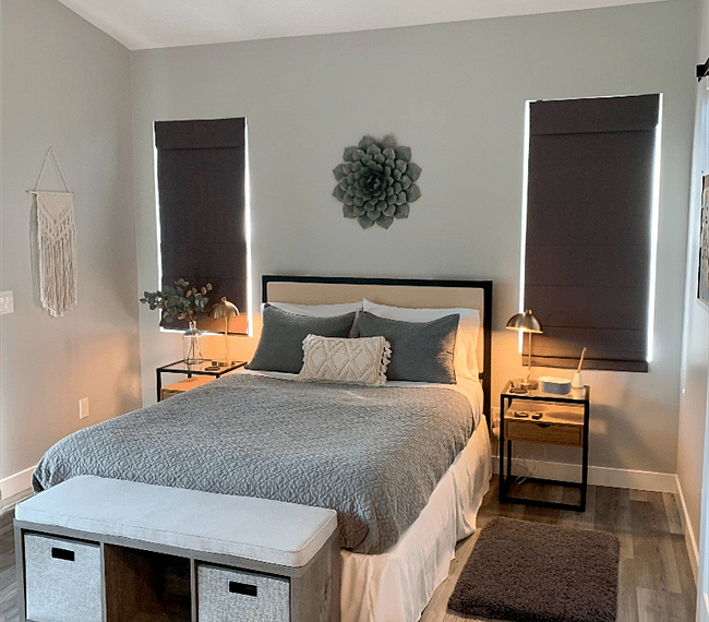 Comfy queen sized bed with night stands, lamps, alarm clock.