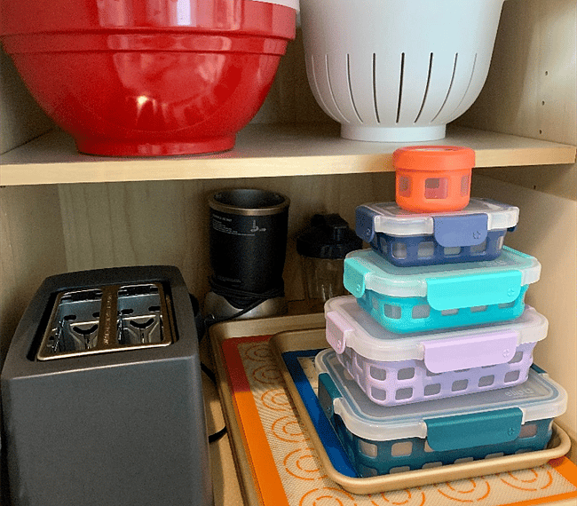 Toaster, Blender, food storage, baking pans, cutting board, bowls, strainer.