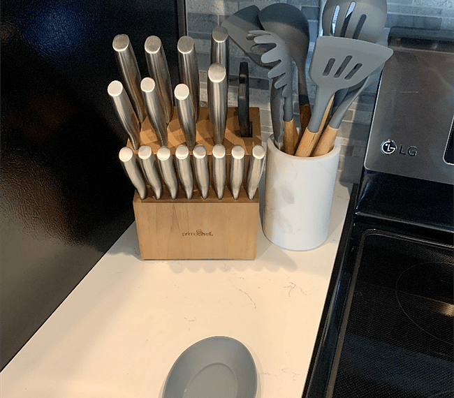 Brand new knife set with cooking utensils.