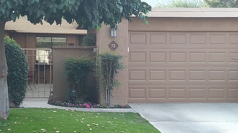 Garage and entry to gated front courtyard