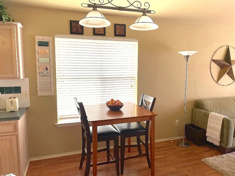This table fits 4 comfortably and has 2 bar stools that can be pulled over. 