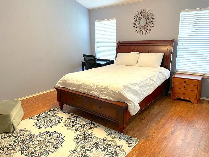 The master is separated from the other bedrooms and is in the back right of the home featuring a very comfy Tempurpedic queen bed and work from home desk. 