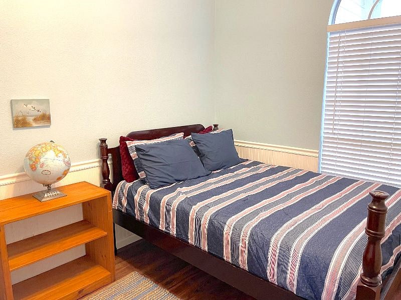 This comfy queen room is in the front of the home and has a work from home desk as well. 