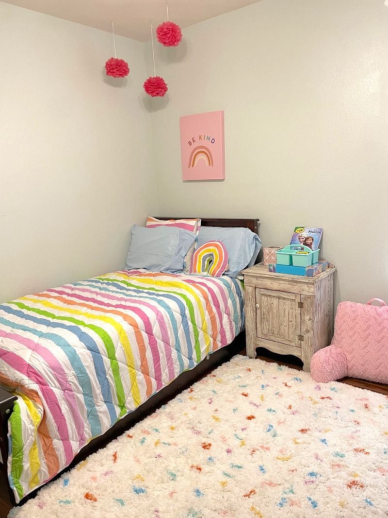 In the middle of the home is a trundle bed room great for kids or an adult. The decor could easily be stored to make this room more neutral. 