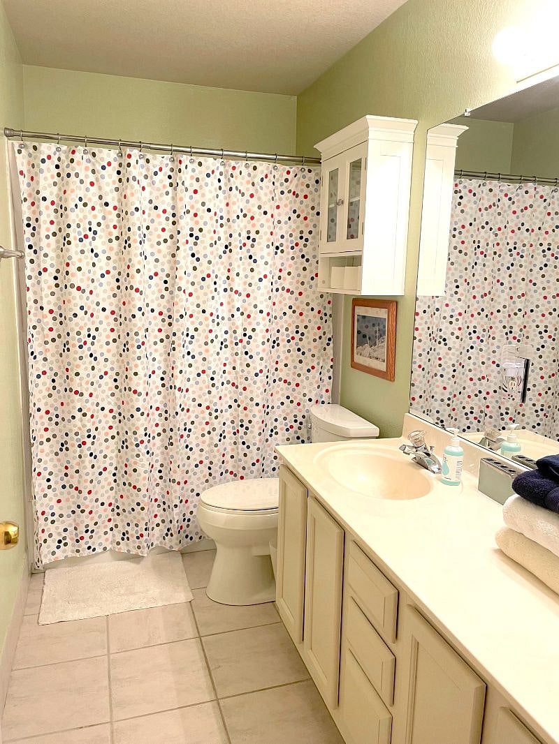 The guest bath features a tub/shower combo. 