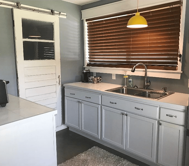 Bathroom beyond sliding barn door