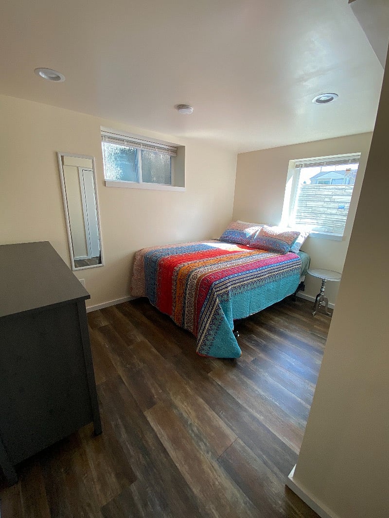 Natural light floods the bedroom.