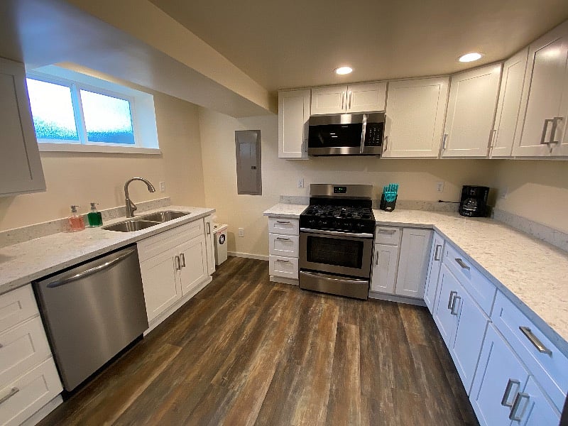Huge kitchen with quartz countertops.