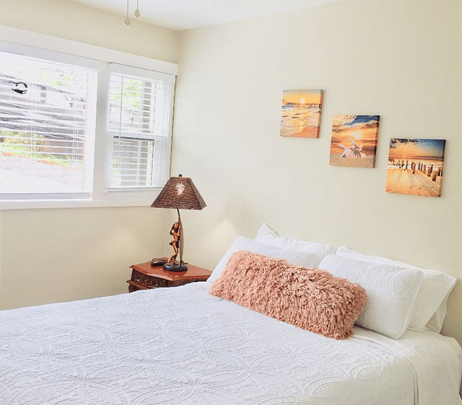 Spacious bedroom 1 with ceiling fan. 
