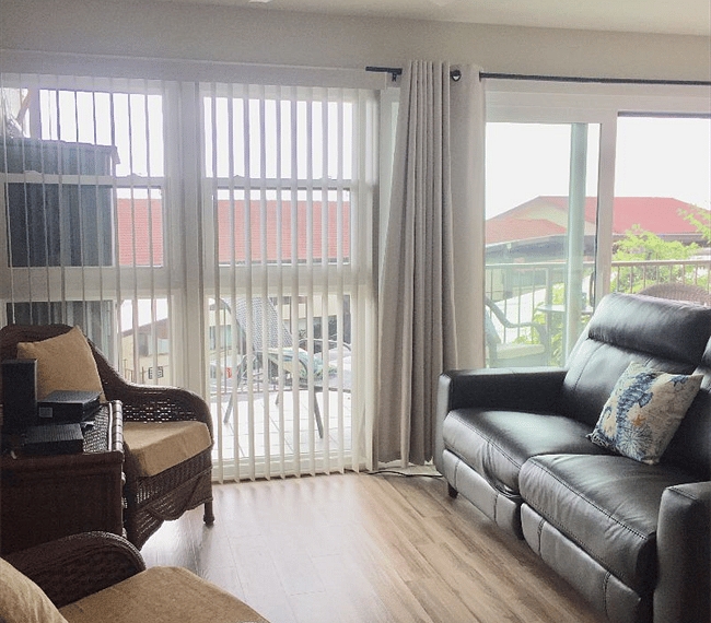 Living room  with comfortable leather electric double recliners. High definition tv with many choices of channels or choice of internet intertainment.