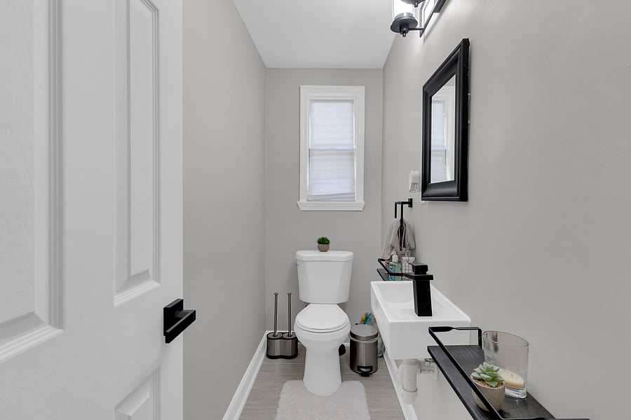 The Powder Room: A convenient main-floor half-bath, ensuring your upstairs suites remain private and personal.