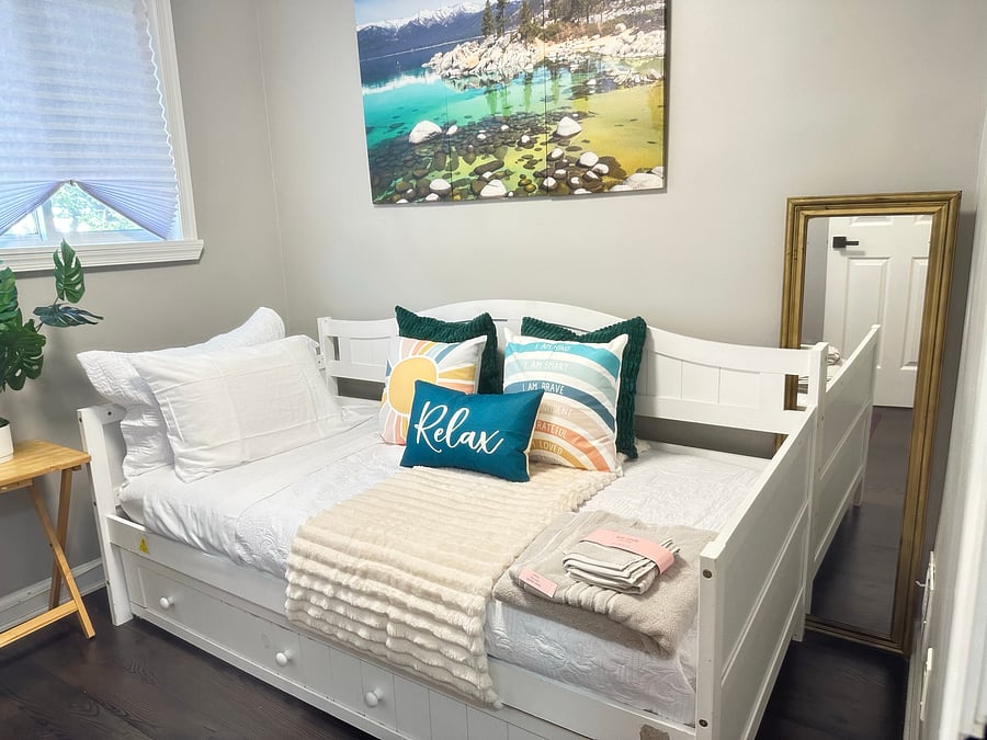 The Flex Room: Beautiful Lake Tahoe inspired sleeps 2! Includes a twin daybed with pull out trundle bed for guest - easily closes to create more room for you to enjoy wellness. Room features pilates reformer/mat, DB method squat machine & free weights.