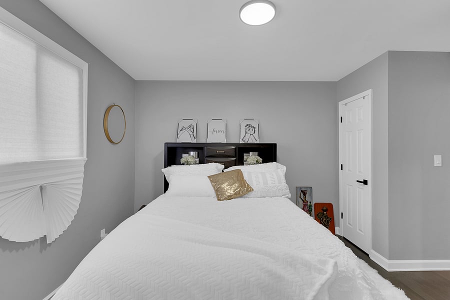 The Primary Suite: A peaceful retreat with a private en-suite bath, beautiful antique floor length mirror, and a Queen bed with premium linens which comfortably sleeps 2.