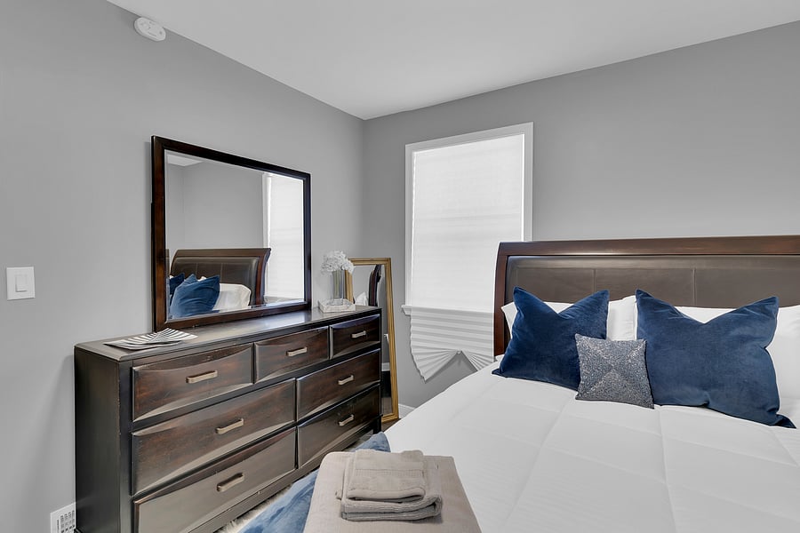 The Guest Suite: A spacious, sun-filled second bedroom with a smart tv, mini fridge, and a relaxing Queen sized bed that comfortably sleeps 2. This room is also adjacent to a full bath just steps away.