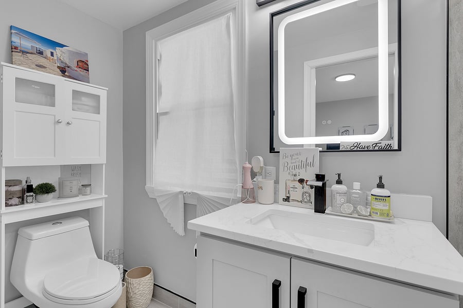 The Primary Suite: A peaceful retreat with a private en-suite bath, beautiful antique floor length mirror, and a Queen bed with premium linens which comfortably sleeps 2.
