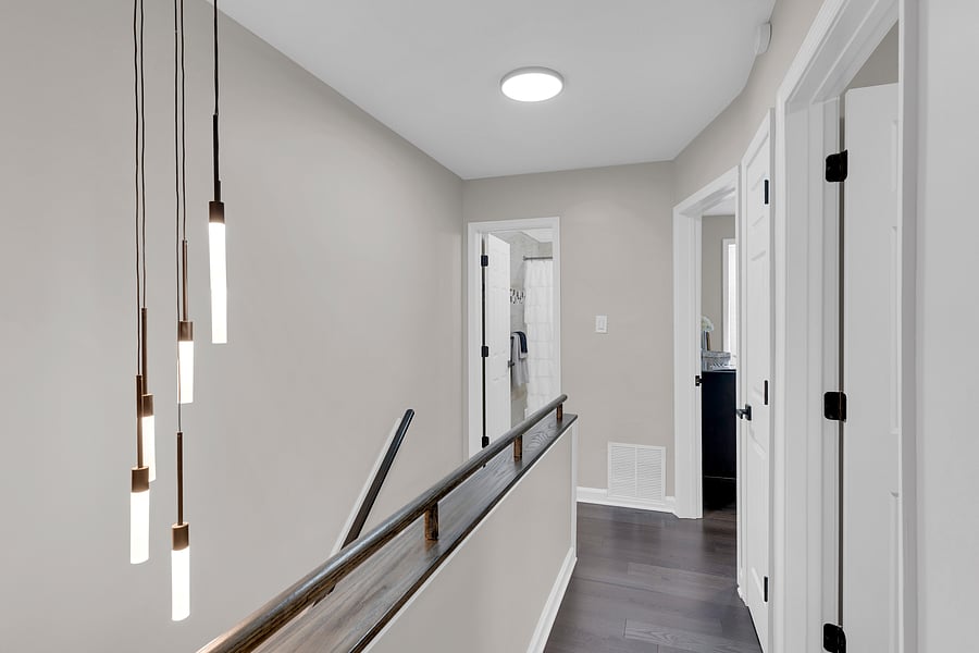 Beautiful chandelier lighting lead up the stairs to the 2nd floor living quarters.