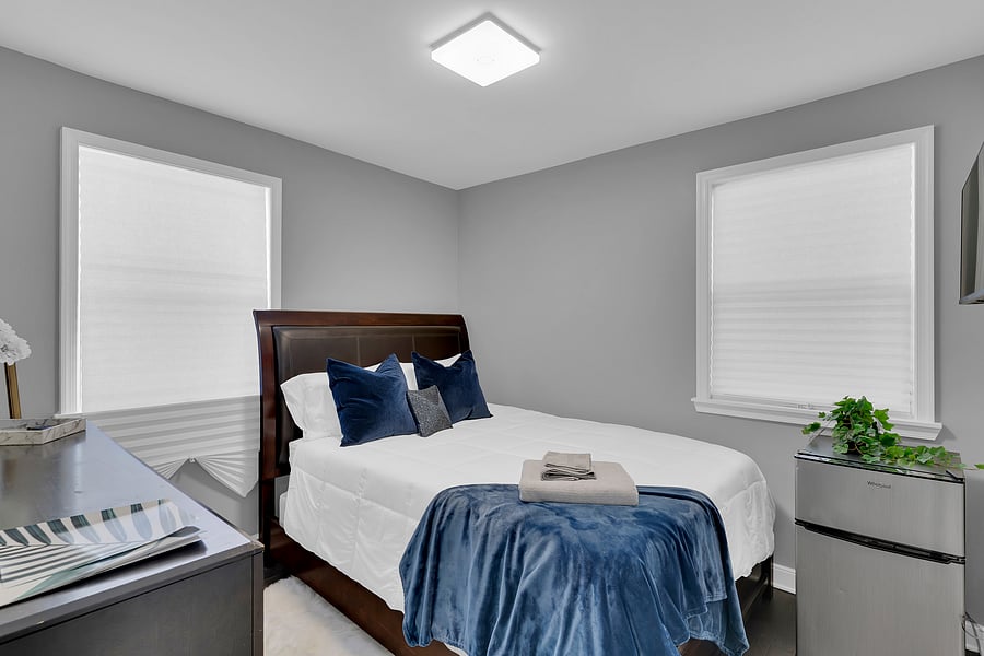 The Guest Suite: A spacious, sun-filled second bedroom with a smart tv, mini fridge, and a relaxing Queen sized bed that comfortably sleeps 2. This room is also adjacent to a full bath just steps away.