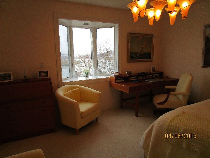 study bedroom 4 - queen bed and desk with view west over inlet and marsh 