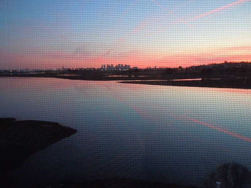 sunset seen from home looking southwest to Boston skyline 