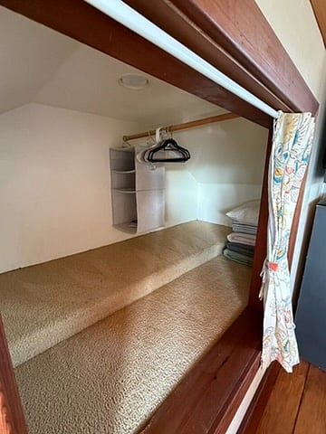 Large closet for hanging clothes and storage.