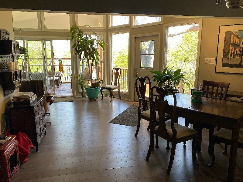 Looking from the kitchen living room into the screened porch.