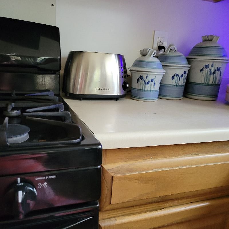 Gas stove and canisters. All large appliances are almost new and insured.