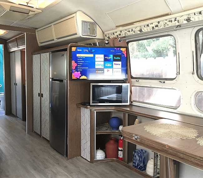 Flat screen TV with Roku, microwave, refrigerator 