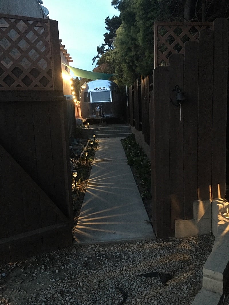 The private walkway is well lit with solar lights