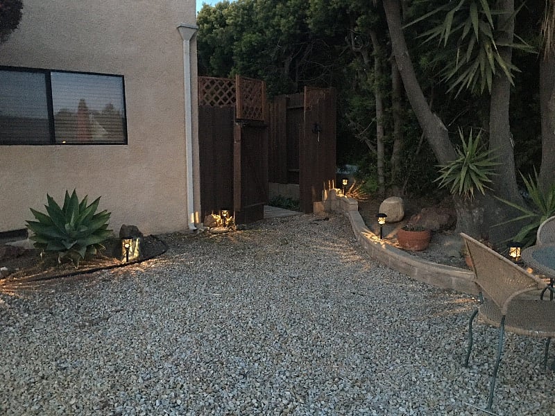 The private gated entrance and parking are well lit with solar lighting