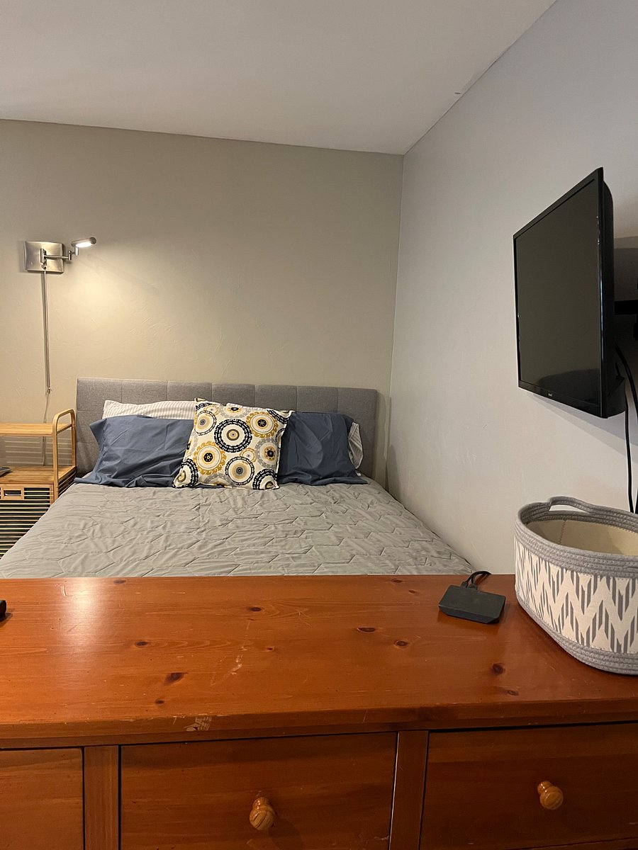 Smart television mounted on wall for easy viewing from anywhere in the studio.