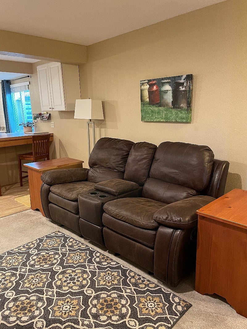 Reclining couch with cup holders.