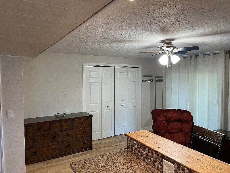 Large dresser and double doored clothes closet.