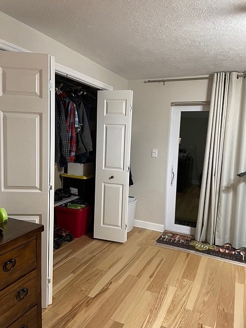 Large 10 feet closet with rods and shelves.