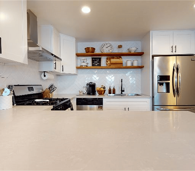 Full kitchen. Full-size stainless steel/ice maker fridge.