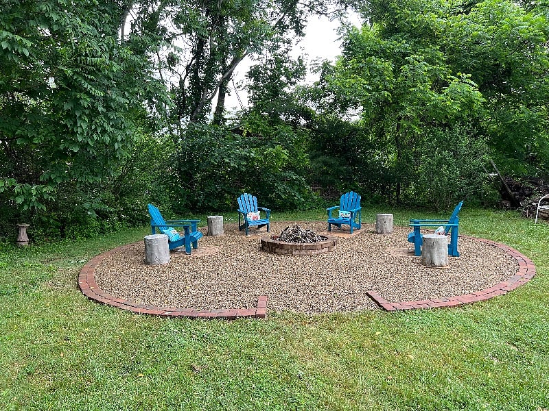 The firepit with 6+ seating options is another great spot for enjoying the yard. There's is a lighted corn hole game if a bit of activity sounds just right. 