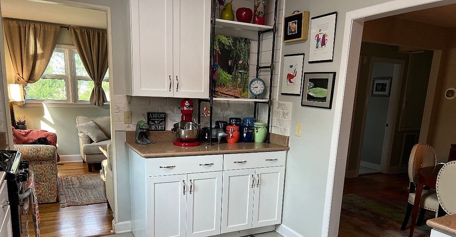 Kitchen opens to living and dining areas.