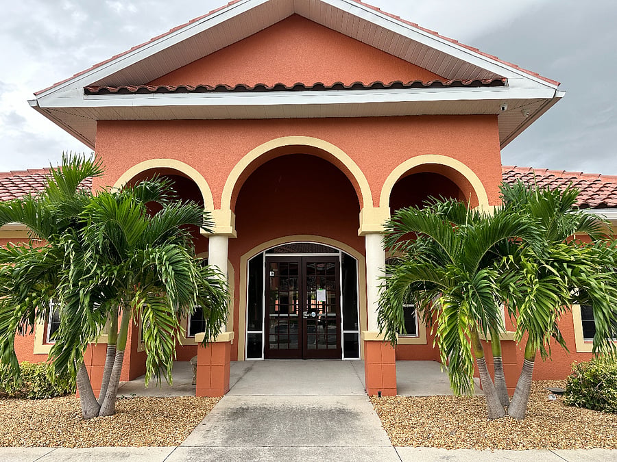 The Clubhouse includes a fitness room, library/reading room, living room with oversized flat screen tv, a shuffleboard table, outdoor heated pool and hot tub.