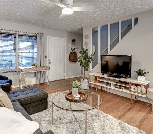 Gorgeous living room with comfy sofas and a TV to enjoy your favorite shows.