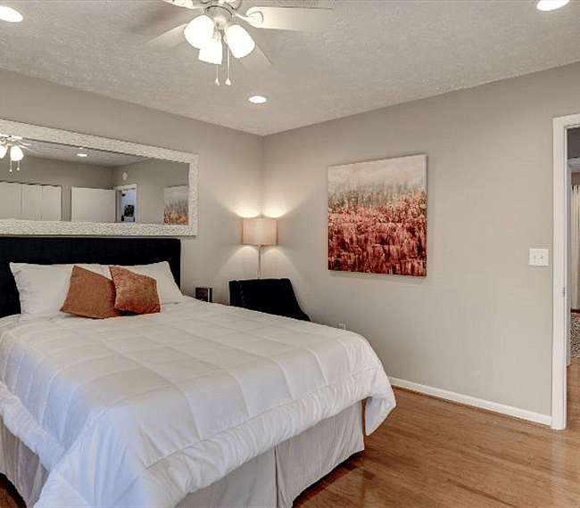 A nightstand with a lamp to make it cozier.