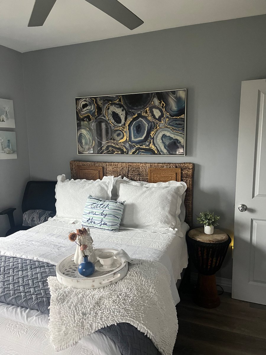 Comfy full size bed with comfortable crisp linen and blankets. Ergonomic Chair to the left for setting near bed or at desk.