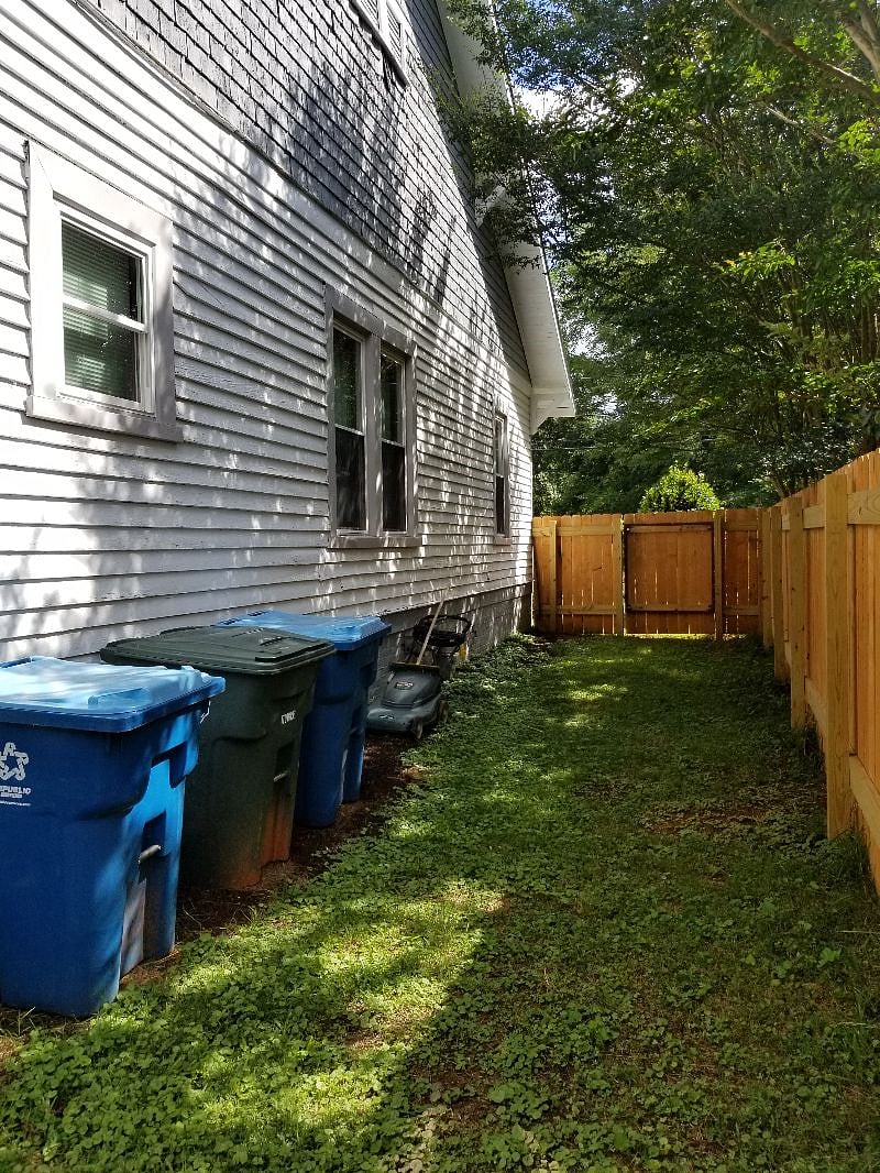 Side yard with gateway dividing front and back yards