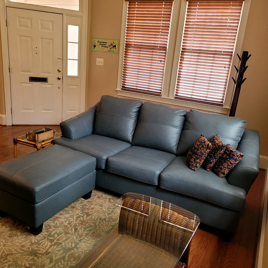Comfy leather sofa. With ottoman