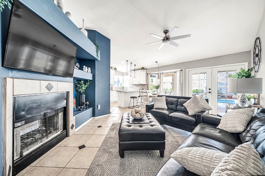 Family Room with pass through fireplace, dining/kitchen table seating for 6, french doors go out to the tropical oasis back yard with the pool.