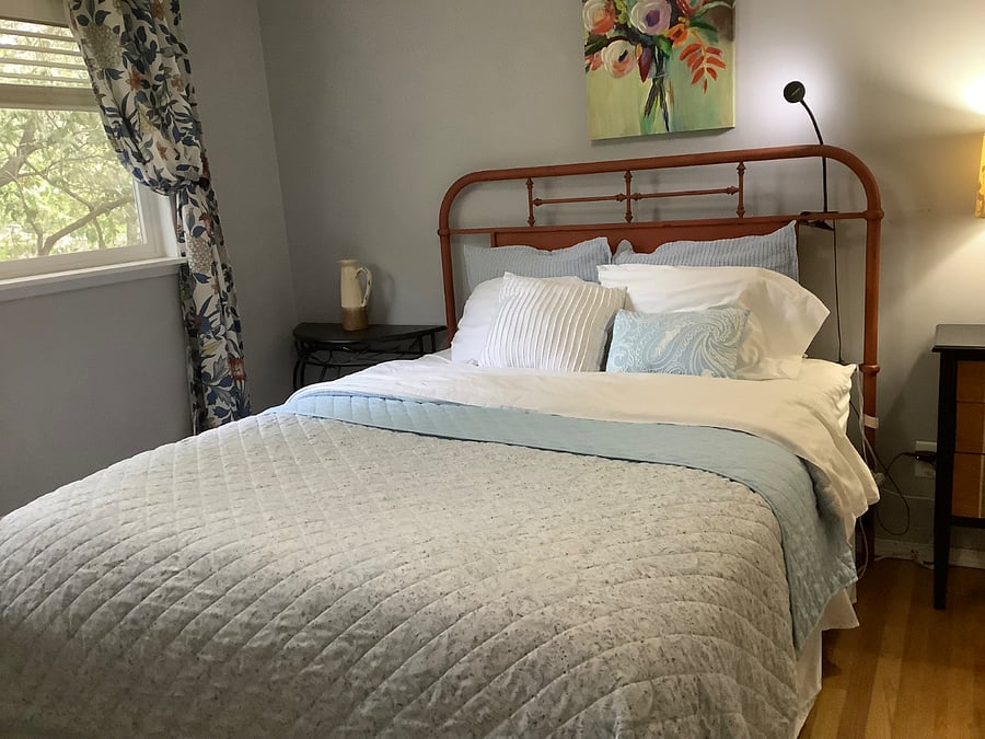 Queen bed in rental suite.