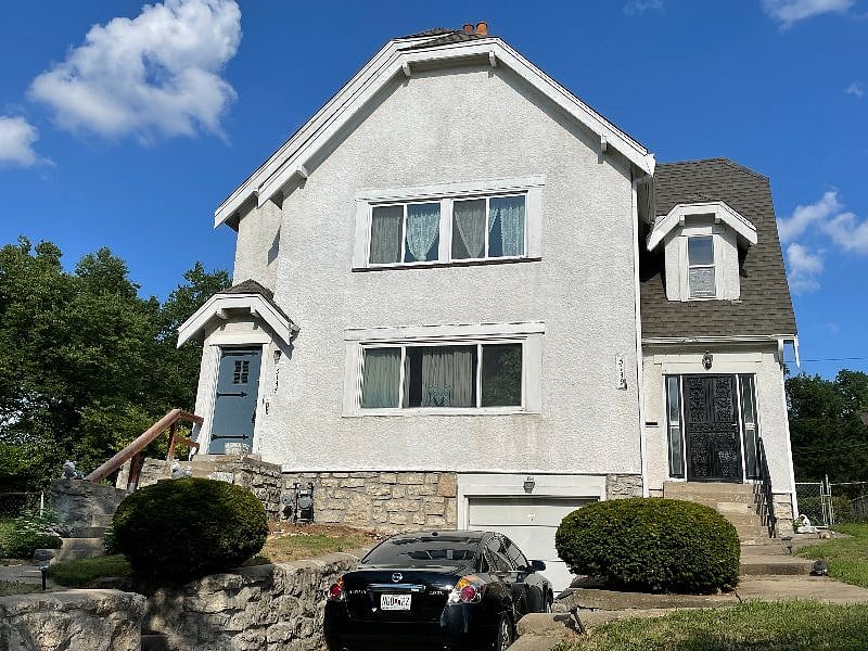 Front of property.  Private entrance to this unit is door on the left.