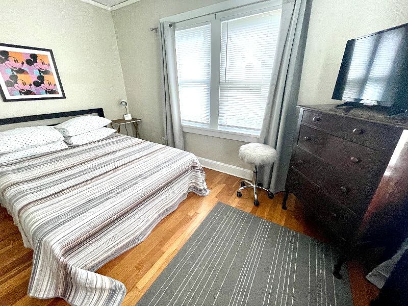 2nd bedroom with queen bed and TV