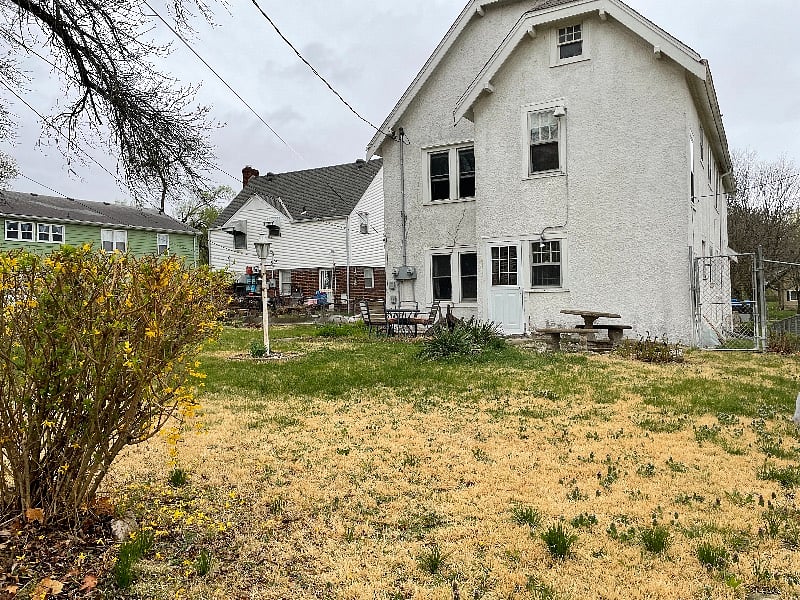 Shared fenced backyard with patio