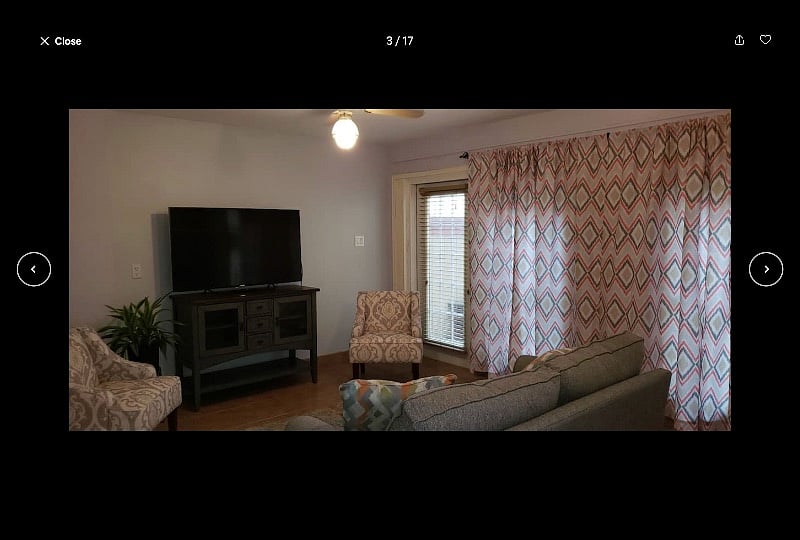 Large den area with large screen TV and queen-size sofa bed (with private patio outside the door).