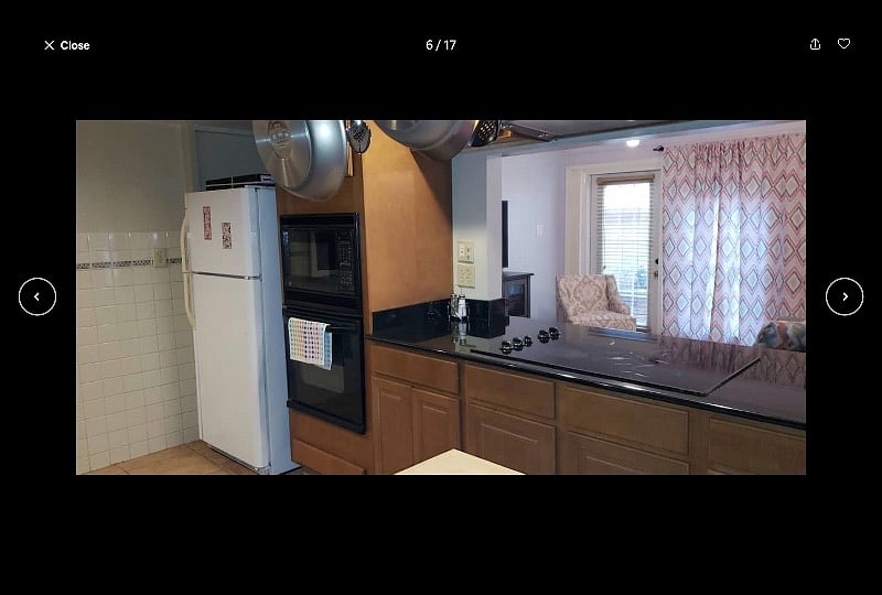 Fully equipped kitchen overlooking the den area. Kitchen adjacent to a full bathroom and large storage room (not pictured).