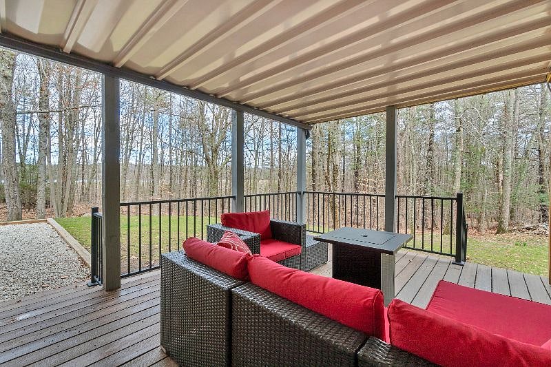Deck with sectional and gas firepit, peekaboo reservoir views.